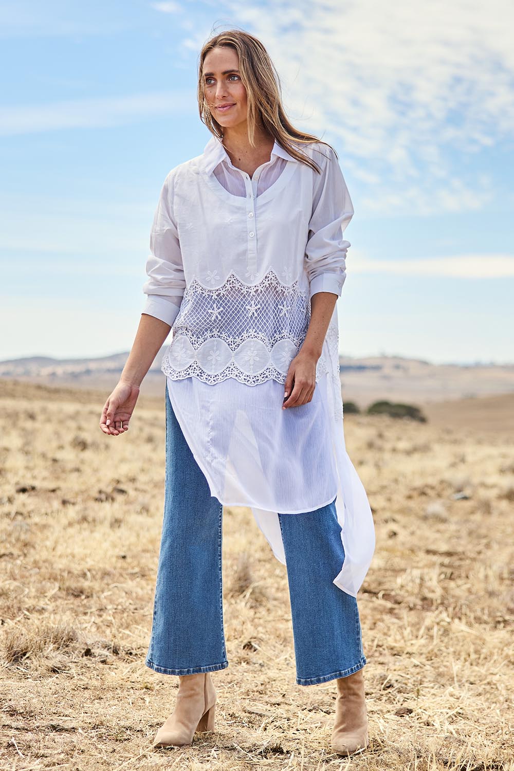 Model Cara wearing size 10 of the My Sweetheart Longline Shirt in colour White (White), from the front, showing the whole outfit
