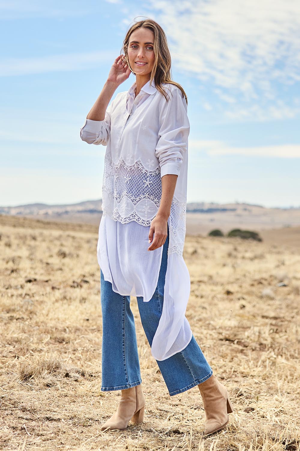 Model Tegan wearing size 10 of the My Sweetheart Longline Shirt in colour White (White), from the front, showing the whole outfit