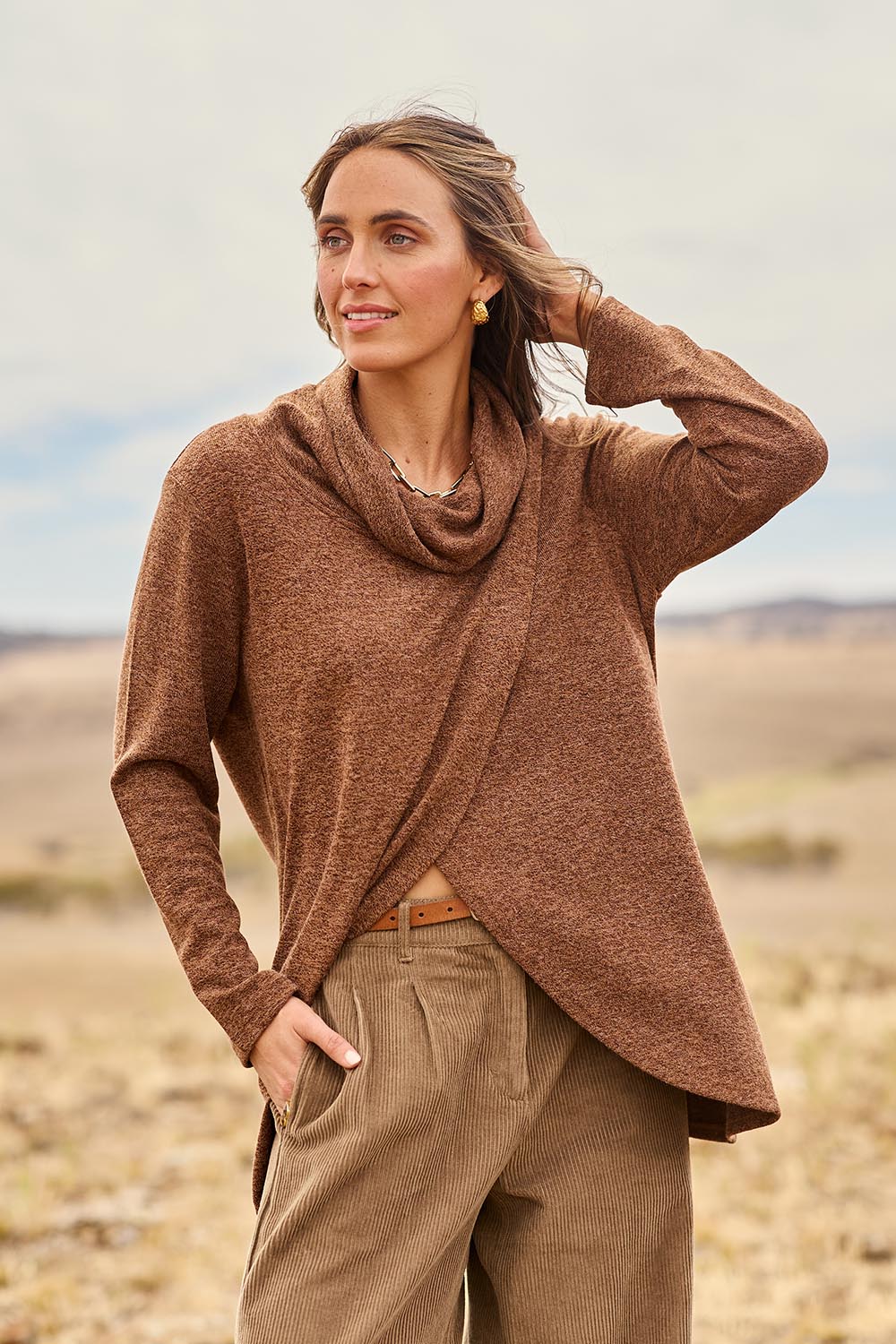 Model Tegan wearing size 10 of the Crossing The Plains Snuggle Jumper in colour Chocolate, from the front, showing the whole outfit