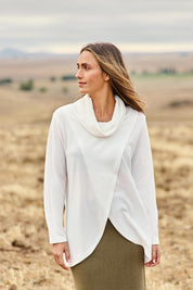 Model Tegan wearing size 10 of the Crossing The Plains Snuggle Jumper in colour Ivory (White), from the front, showing the whole outfit