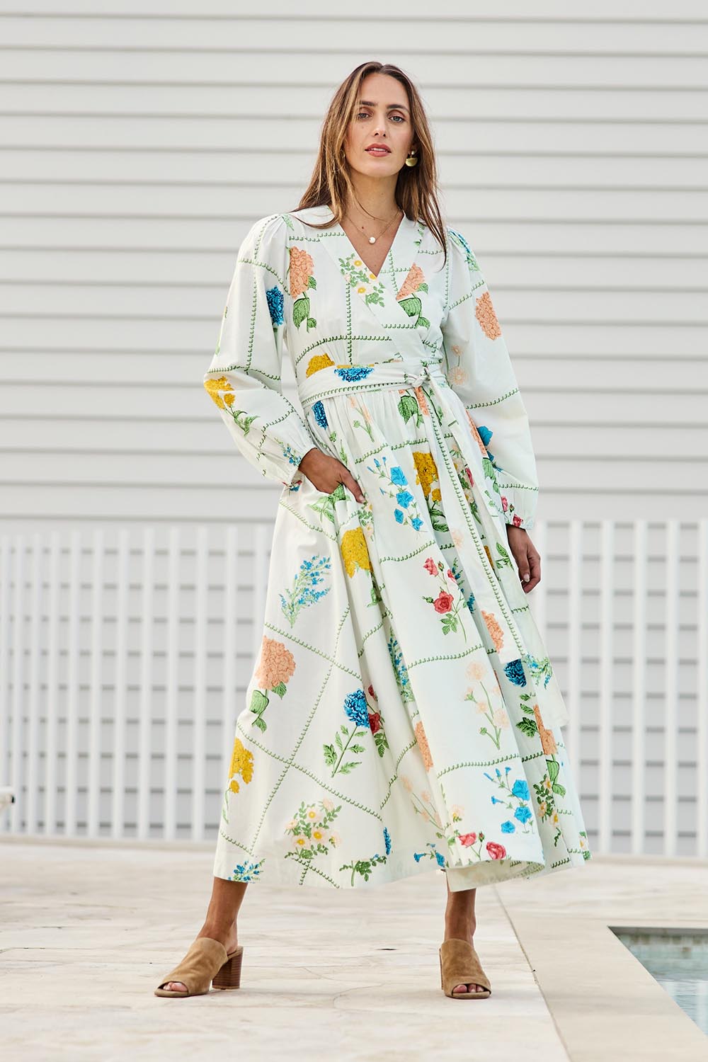 Model Tegand wearing size 10 of the Walking On Sunshine Cotton Maxi Wrap Dress – Flower in colour Flower, from the front