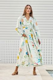 Model Tegand wearing size 10 of the Walking On Sunshine Cotton Maxi Wrap Dress – Flower in colour Flower, from the front