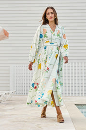 Model Tegand wearing size 10 of the Walking On Sunshine Cotton Maxi Wrap Dress – Flower in colour Flower, from the front