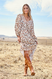 Model Tegan wearing size 10 of the Picnic In The Park Dress in colour Rustfleur, from the front, showing the whole outfit