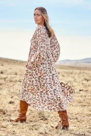 Model Tegan wearing size 10 of the Picnic In The Park Dress in colour Rustfleur, from the front, showing the whole outfit