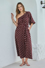 Model Tegand wearing size 10 of the Spotted You One Shoulder Cotton Maxi – Chocolate in colour Chocolate, from the front