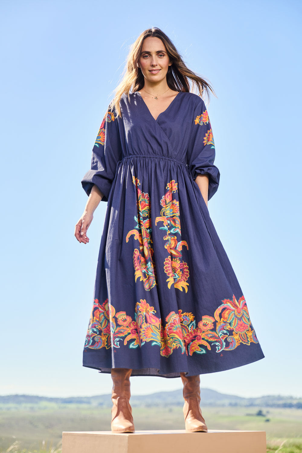Model Tegand wearing size 10 of the When Im With My Folk Cotton Dress – Navyfleur in colour Navyfleur, from the front