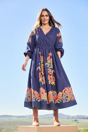 Model Tegand wearing size 10 of the When Im With My Folk Cotton Dress – Navyfleur in colour Navyfleur, from the front