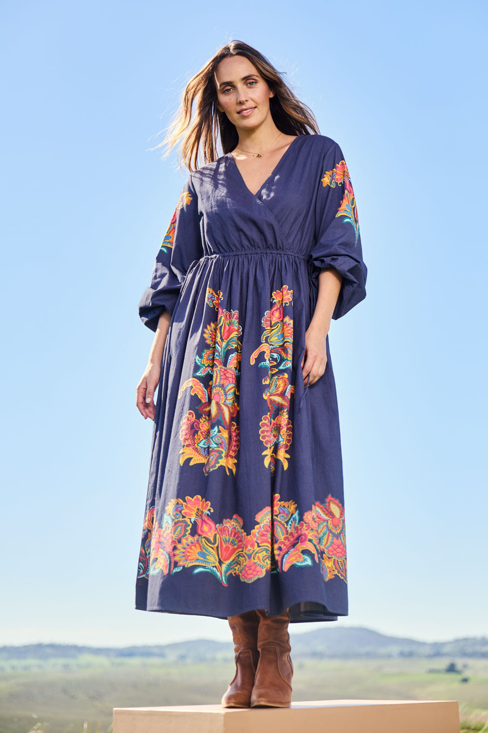 Model Tegand wearing size 10 of the When Im With My Folk Cotton Dress – Navyfleur in colour Navyfleur, from the front