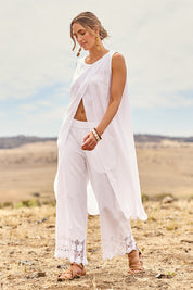 Model Tegan wearing size 10 of the Broderie Delight Cotton Pants in colour White (White), from the front, showing the whole outfit