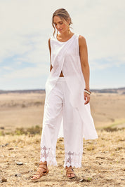 Model Tegan wearing size 10 of the Broderie Delight Cotton Pants in colour White (White), from the front, showing the whole outfit