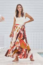 Model Tegand wearing size 10 of the Wrap Me With Love Cotton Maxi Skirt – Garden in colour Garden, from the front
