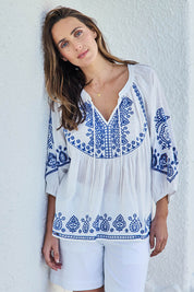 Model Tegand wearing size 10 of the Loving You Is Easy Embroidered Cotton Blouse – Whiteblue in colour Whiteblue, in a cropped view