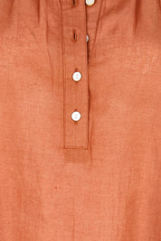 Product shot of the Out And About Cotton Blouse – Rust in colour Rust, showing detail