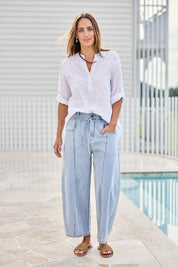 Model Tegand wearing size 10 of the You Make Me Happy Barrel Leg Jeans – Denim in colour Denim, from the front