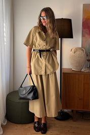 Model Genericm wearing size sample of the Going Places Denim Skirt – Sand in colour Sand, from the front
