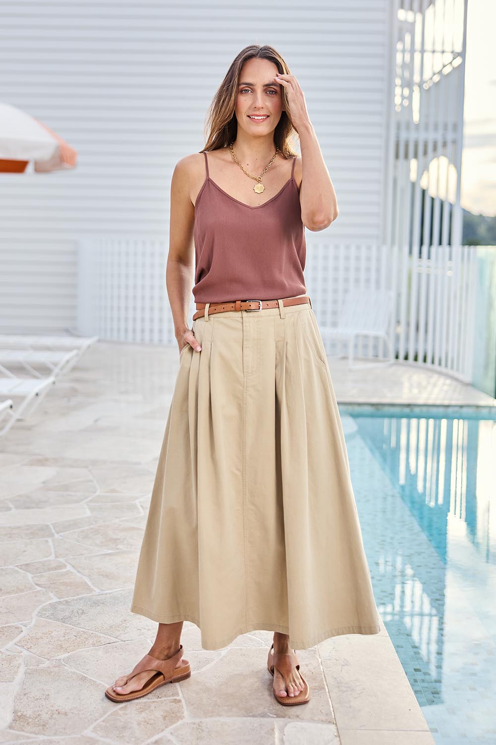 Model Tegand wearing size 10 of the Going Places Denim Skirt – Sand in colour Sand, from the front