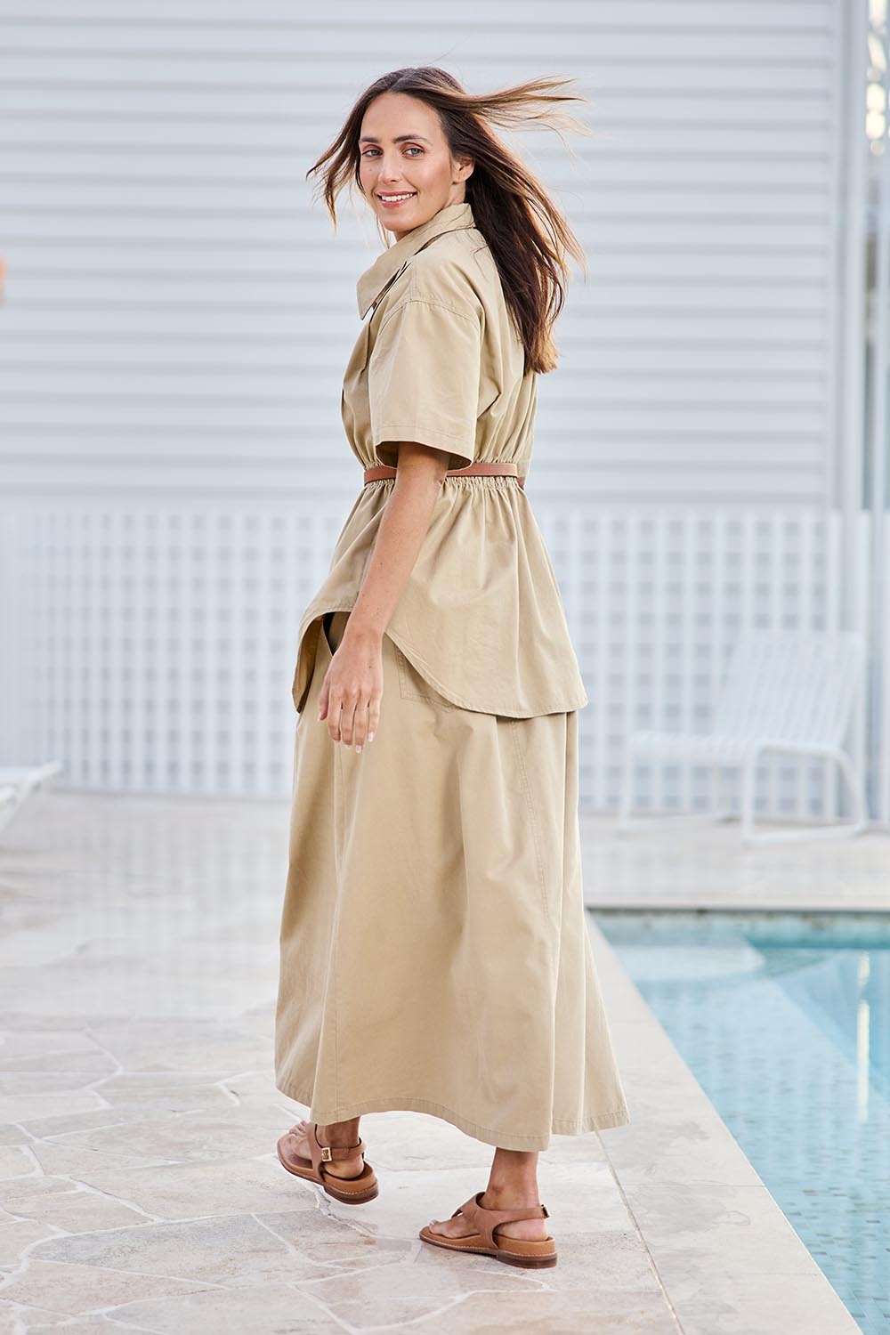 Model Tegand wearing size 10 of the Going Places Denim Skirt – Sand in colour Sand, from the front