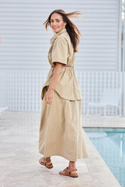 Model Tegand wearing size 10 of the Going Places Denim Skirt – Sand in colour Sand, from the front