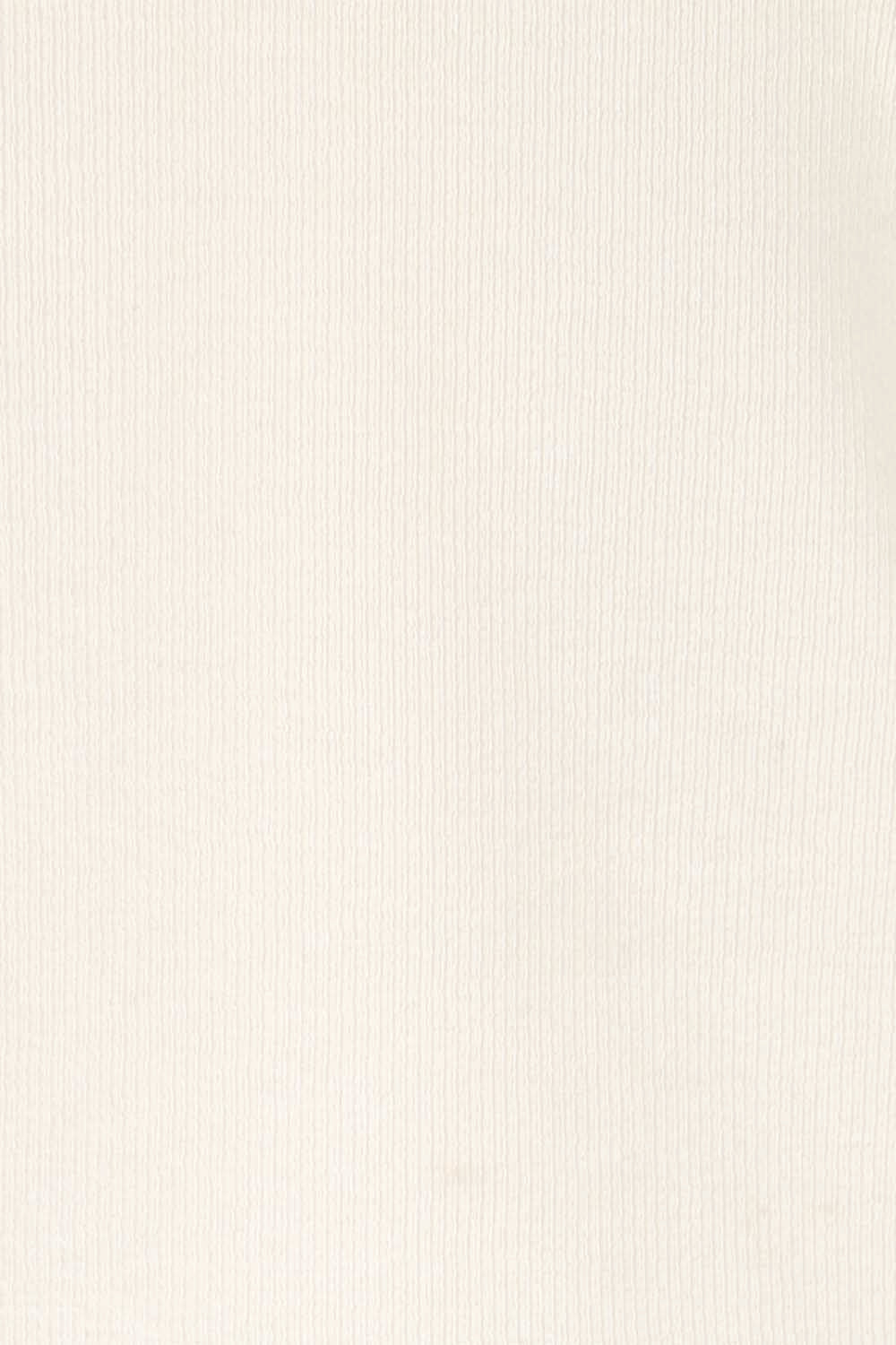 Product shot of the Sweet Intentions Deep V Neck Tank – Cream in colour Cream, showing detail