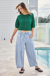 Model Tegand wearing size 10 of the Clear Skies Balloon Sleeve Cotton Blend Cardi – Dreamgreen in colour Dreamgreen, from the front