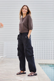 Model Tegand wearing size 10 of the Ready for Anything Cargo Pants – Black in colour Black, from the front