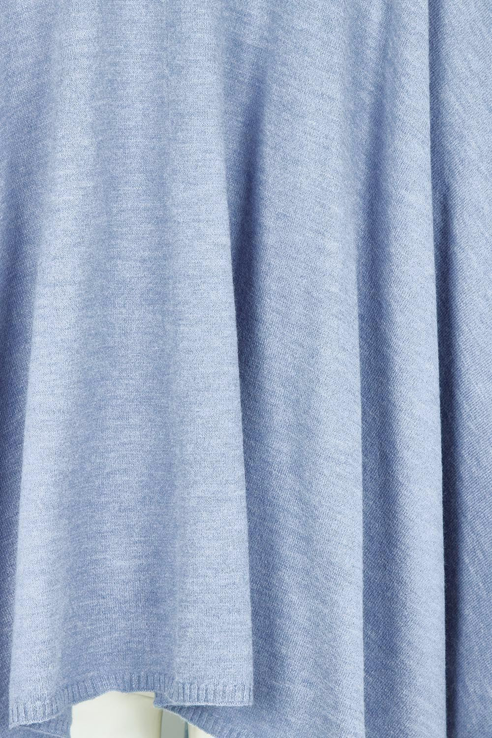 Product shot of the Wrap Me Up Knit Throw Cape – Denim in colour Denim, showing detail
