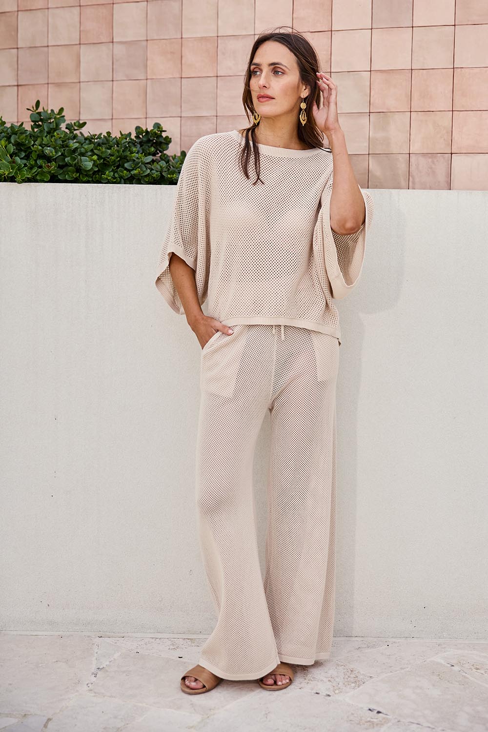 Model Tegand wearing size 10 of the Summer Ready Cotton Overlay Knit Pants – Natural in colour Natural, from the front