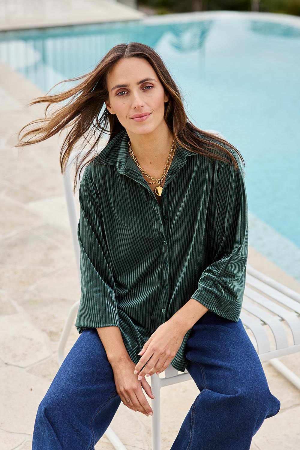 Model Tegand wearing size 10 of the Shine Your Light Velvet Shirt – Thyme in colour Thyme, in a cropped view
