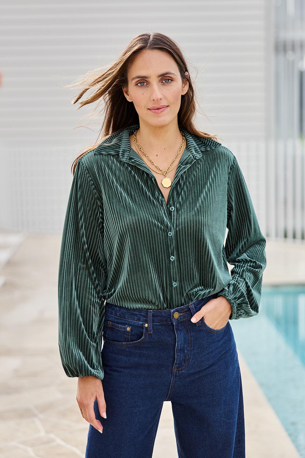 Model Tegand wearing size 10 of the Shine Your Light Velvet Shirt – Thyme in colour Thyme, in a cropped view