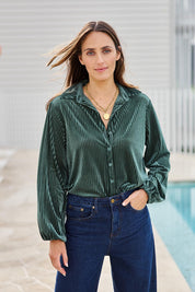 Model Tegand wearing size 10 of the Shine Your Light Velvet Shirt – Thyme in colour Thyme, in a cropped view