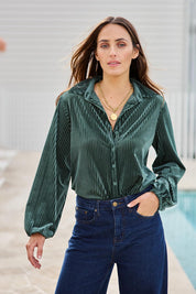 Model Tegand wearing size 10 of the Shine Your Light Velvet Shirt – Thyme in colour Thyme, in a cropped view