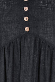 Product shot of the Cute As A Button Cotton Midi Dress – Black in colour Black, showing detail