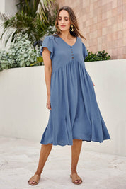 Model Tegand wearing size 10 of the Cute As A Button Cotton Midi Dress – Bluebell in colour Bluebell, from the front
