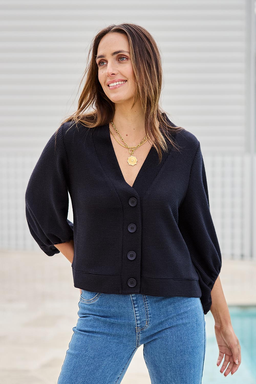 Model Tegand wearing size 10 of the Easy Day Balloon Sleeve Cropped Cardi – Black in colour Black, in a cropped view