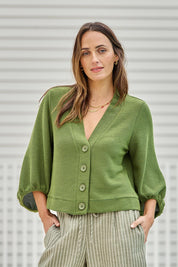 Model Tegand wearing size 10 of the Easy Day Balloon Sleeve Cropped Cardi – Lush in colour Lush, in a cropped view
