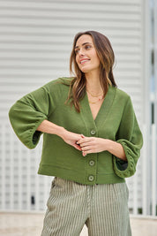 Model Tegand wearing size 10 of the Easy Day Balloon Sleeve Cropped Cardi – Lush in colour Lush, in a cropped view