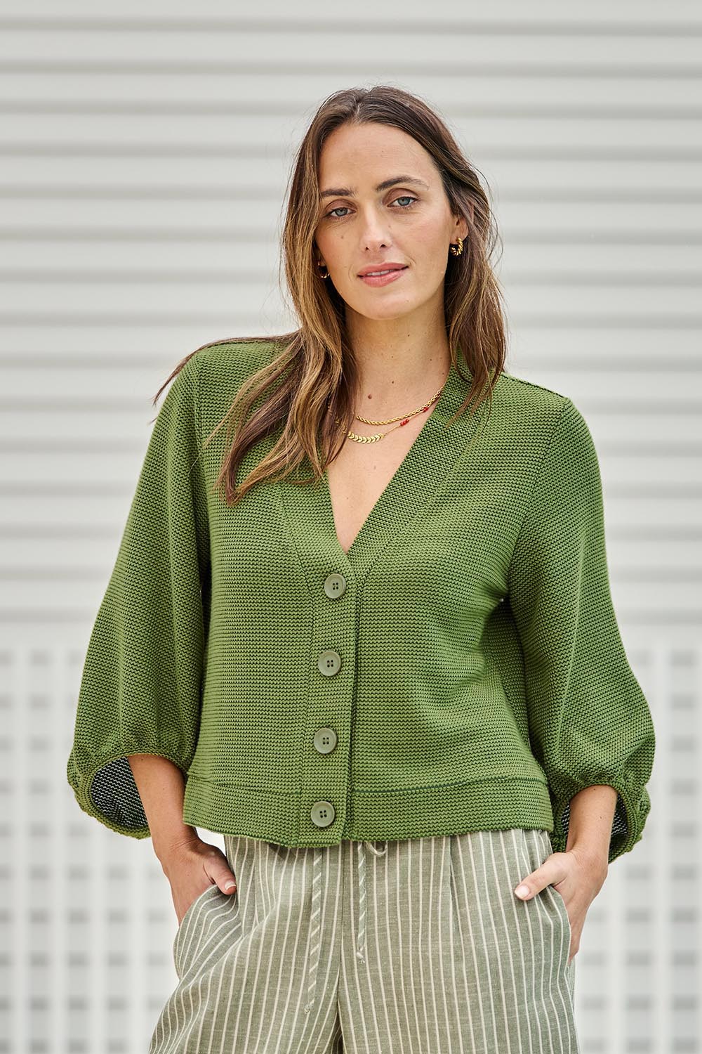 Model Tegand wearing size 10 of the Easy Day Balloon Sleeve Cropped Cardi – Lush in colour Lush, in a cropped view