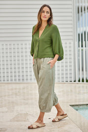 Model Tegand wearing size 10 of the Easy Day Balloon Sleeve Cropped Cardi – Lush in colour Lush, from the front