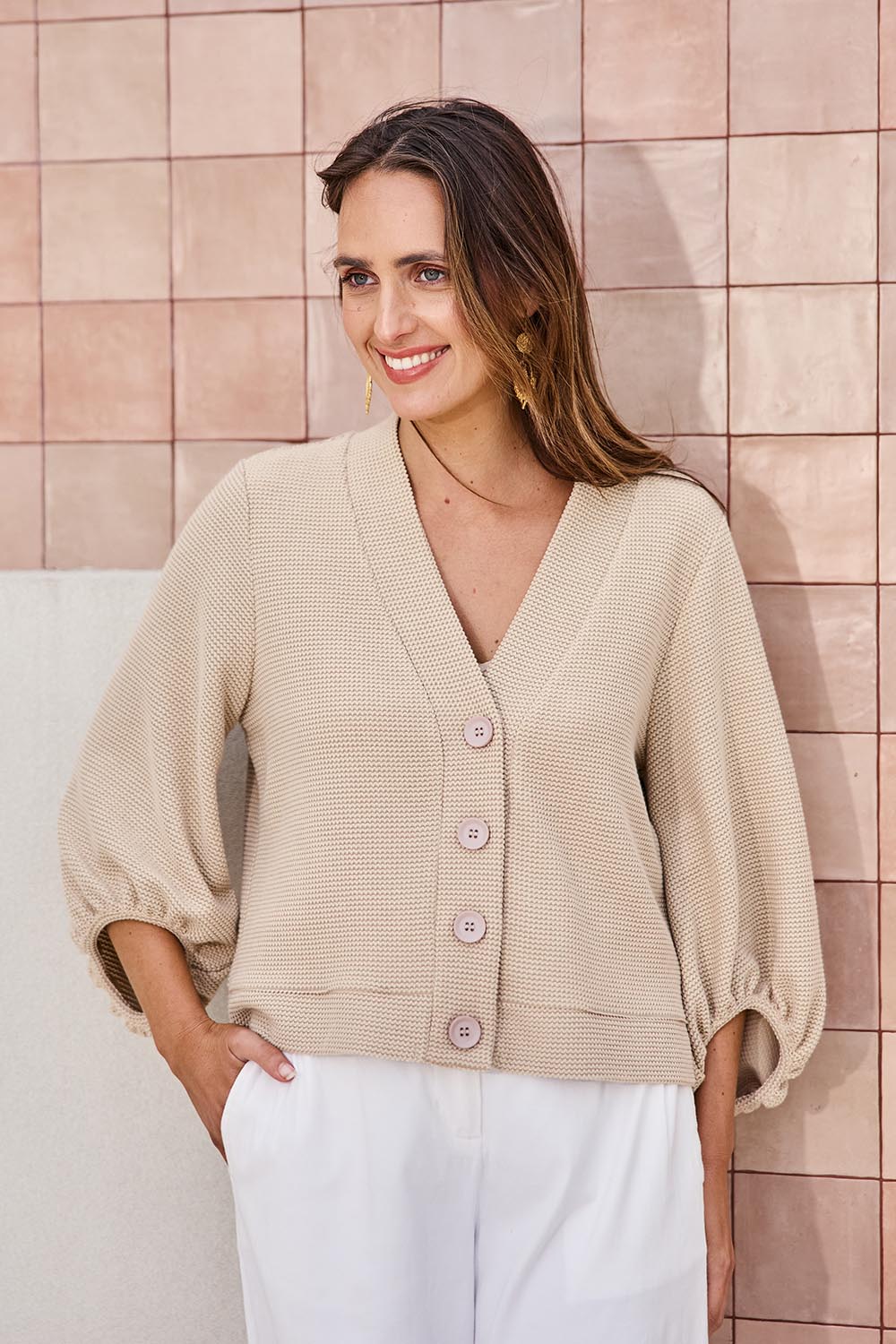 Model Tegand wearing size 10 of the Easy Day Balloon Sleeve Cropped Cardi – Pumice in colour Pumice, in a cropped view