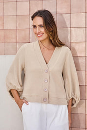 Model Tegand wearing size 10 of the Easy Day Balloon Sleeve Cropped Cardi – Pumice in colour Pumice, in a cropped view