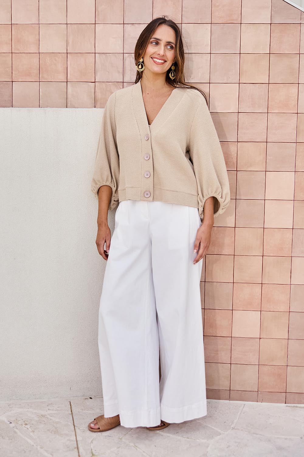 Model Tegand wearing size 10 of the Easy Day Balloon Sleeve Cropped Cardi – Pumice in colour Pumice, from the front