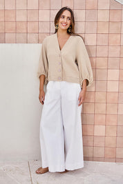 Model Tegand wearing size 10 of the Easy Day Balloon Sleeve Cropped Cardi – Pumice in colour Pumice, from the front