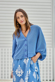 Model Tegand wearing size 10 of the Easy Day Balloon Sleeve Cropped Cardi – Skyblue in colour Skyblue, in a cropped view