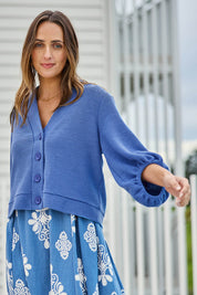 Model Tegand wearing size 10 of the Easy Day Balloon Sleeve Cropped Cardi – Skyblue in colour Skyblue, in a cropped view