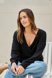 Model Tegand wearing size 10 of the Cross My Heart Sweater – Black in colour Black, from an angle