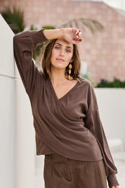Model Tegand wearing size 10 of the Cross My Heart Sweater – Chocolate in colour Chocolate, from an angle