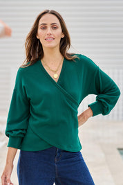 Model Tegand wearing size 10 of the Cross My Heart Sweater – Green in colour Green, in a cropped view