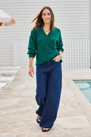 Model Tegand wearing size 10 of the Cross My Heart Sweater – Green in colour Green, from the front
