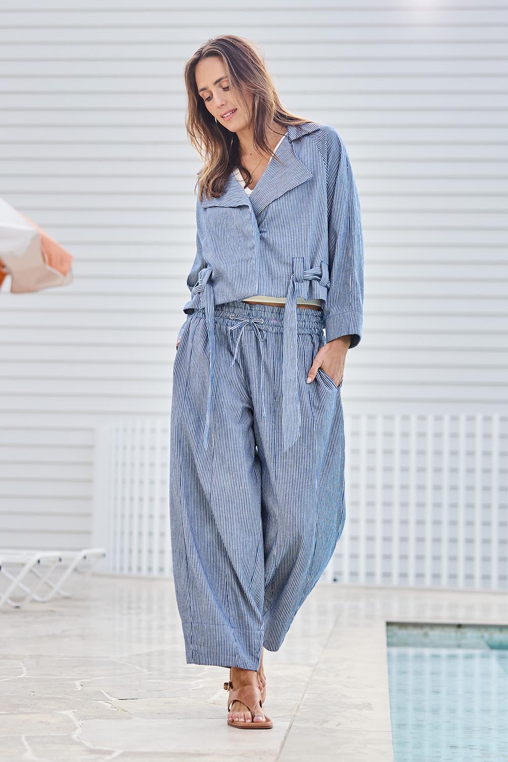 Model Tegand wearing size 10 of the Errand Run Cotton Pull On Pants – Bluestripe in colour Bluestripe, from the front